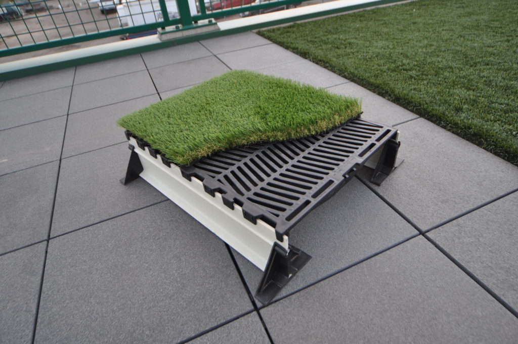 Mock-up sample of the sytem.  We actually put this together, not only to show the various components of the system, but also to mock up a test of a system for high wind areas.  This doubled as a test for adhering the turf to the hog slats. No we just need a project to test it on!